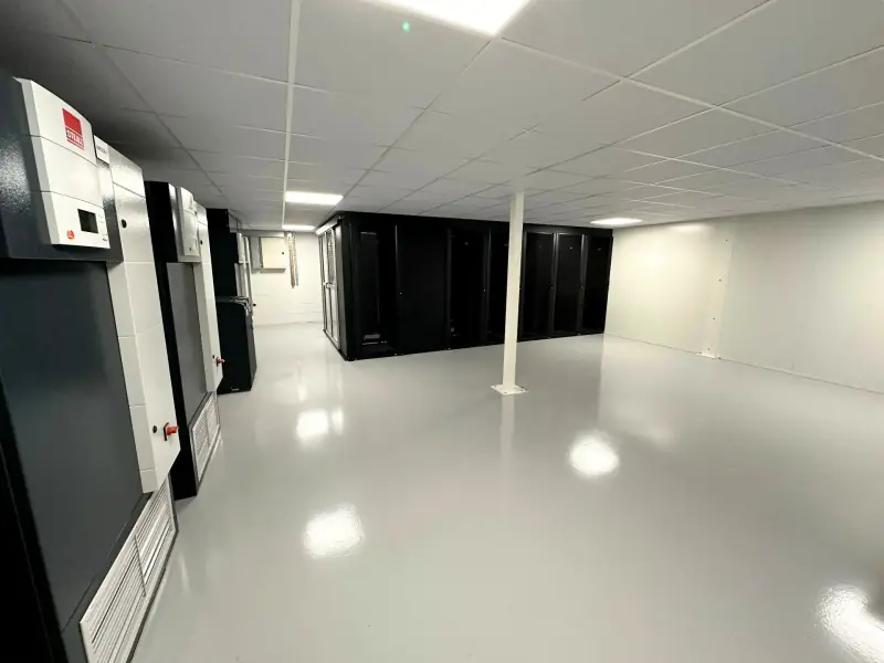 Rows of colocation cabinets in the Fast2host Cambridge Tier III data centre